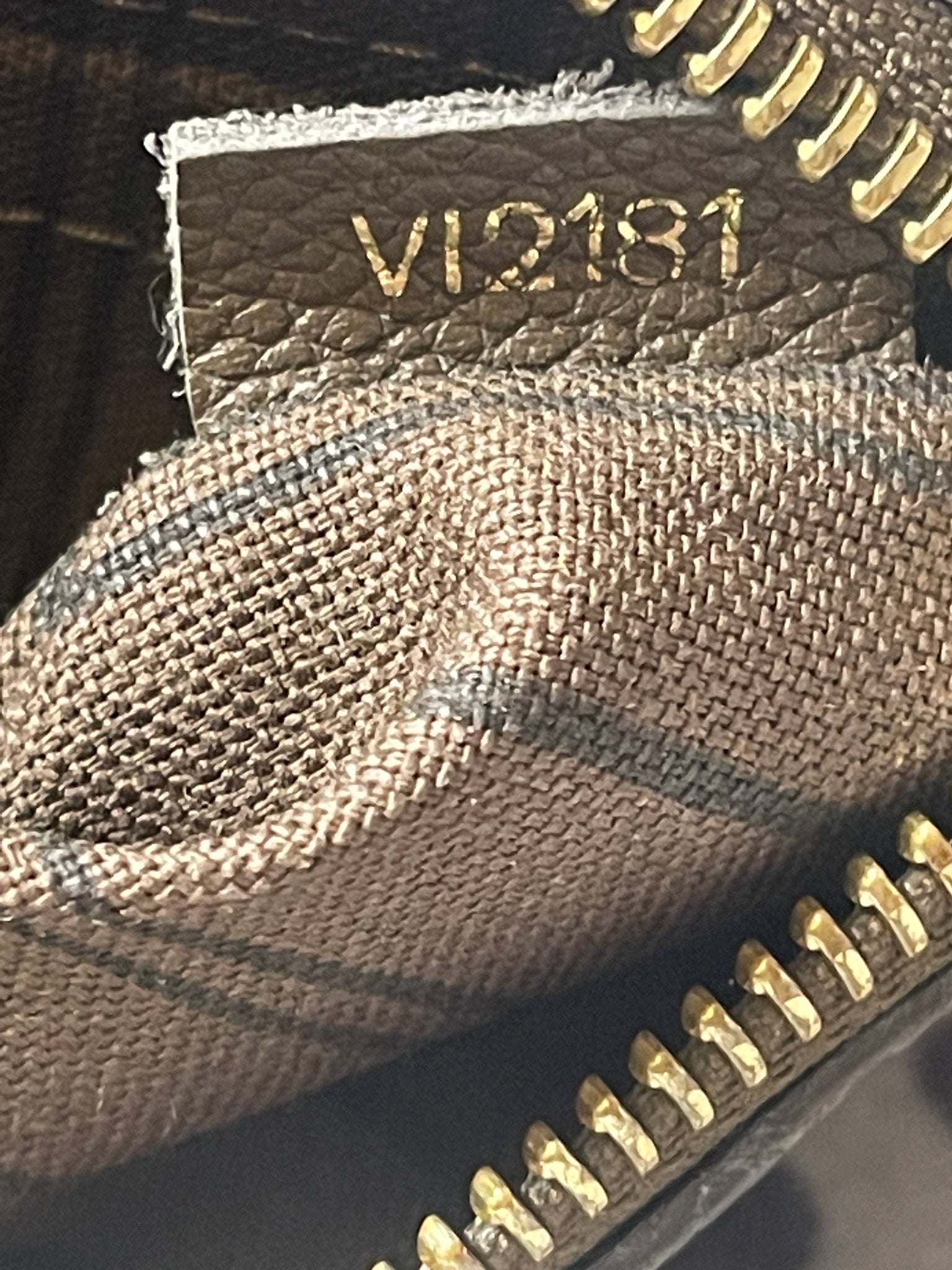 Louis Vuitton Brown Empreinte Leather Mini Pochette VI2181